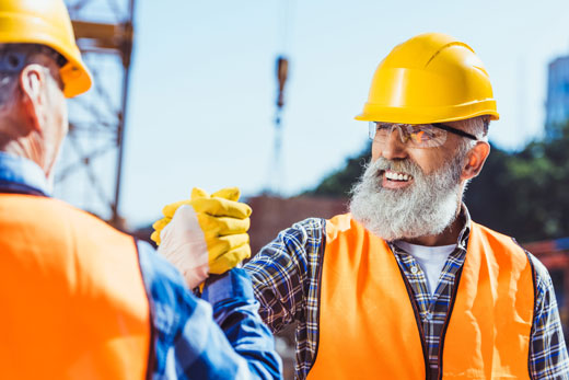 smiling-construction-worker-in-protective-uniform
