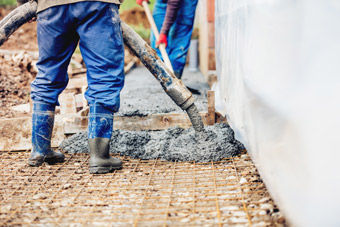 constuction-details-worker-laying-cement-or-conc